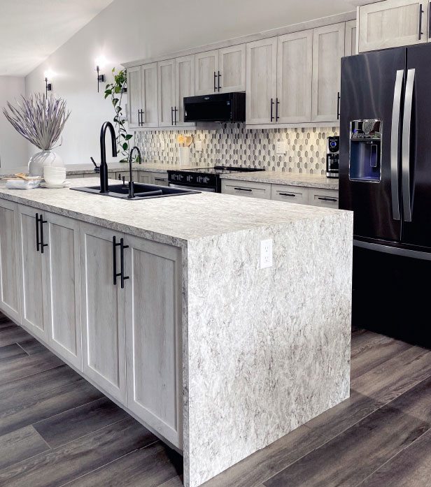 Natural woodgrain cabinet fronts in an airy kitchen